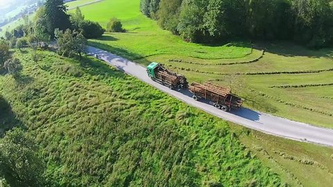timber truck aerial view. timber truck on a pass in the alps of Austria, with plenty of wood