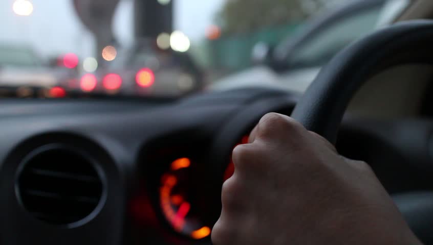 Car Driving in the Rain. Hand Drive.