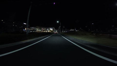 HANEDA AIRPORT, JAPAN - MARCH 19. Driver view nightscape of the new International terminal at Haneda Airport.