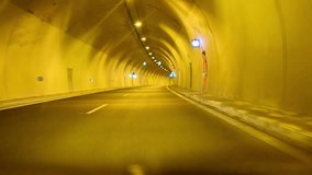 Driving POV freeway time lapse through tunnel highway, HD stock video