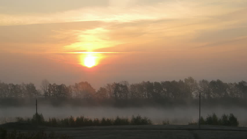 rural mist landscape with sunrise over lake 