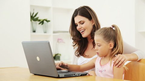 Mother and Daughter Using a Laptop