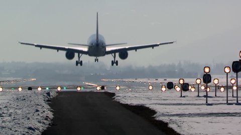 aircraft landing in airport, winter