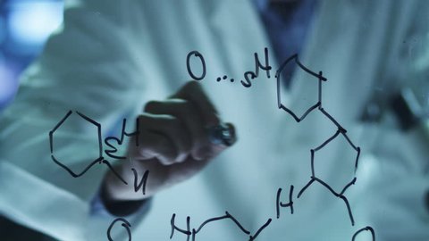  Scientist is Drawing Organic Chemical Formulas on Glass. Shot on RED Cinema Camera in 4K (UHD).