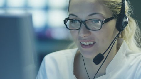 Woman Operator in Customer Support Service Center. Shot on RED Cinema Camera in 4K (UHD).