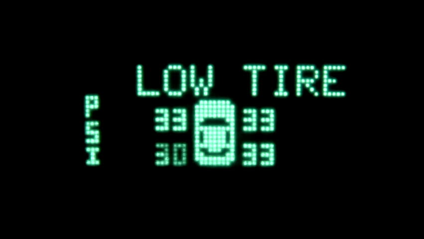 Close-up of a low tire warning.