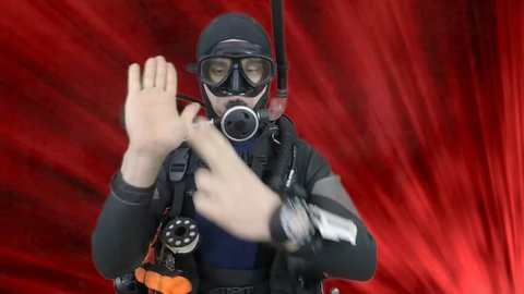 Dive instructor shows sing.HOW MUCH AIR LEFT also a available on the green screen all of diving sings from course  with full dive gear,all background from movies separately in portfolio.5  /9