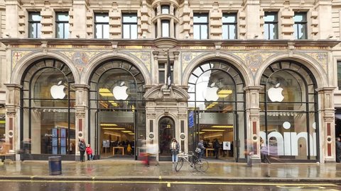 LONDON - APRIL 12, 2013: Traffic time lapse in front of the Apple Store. As of 2014, Apple employs 72,800 permanent full-time employees, maintains 437 retail stores in fifteen countries.