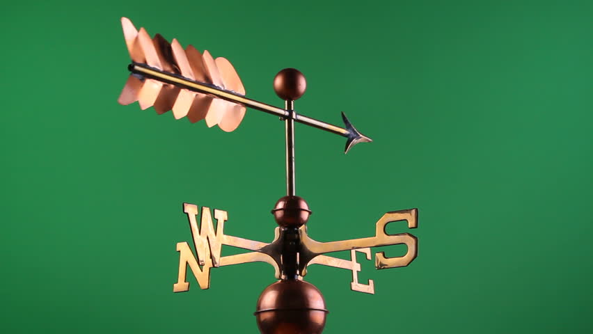 A moving weather vane on a green screen background for chroma key
