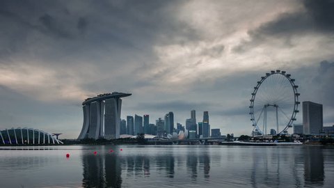 SINGAPORE, SINGAPORE - OCTOBER 2014: day till night coast view flyer and marina bay sands hotel 4k time lapse circa october 2014 singapore, singapore.