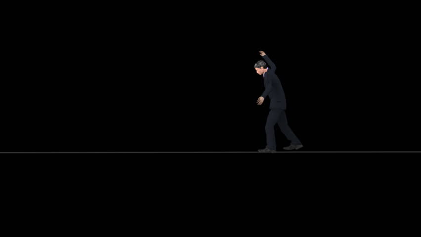 Man in a suit walking a tightrope on a black background. Comes with Alpha.