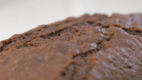 Tasty chocolate cake texture slow panning 4K 2160p UltraHD footage - Chocolate cake surface cracked on plate pan 4K 3840X2160 UHD video