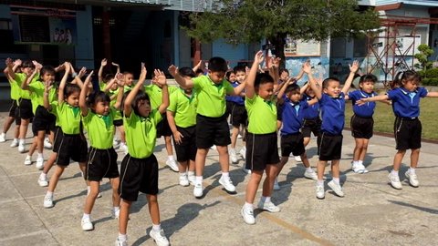 BANGKOK, THAILAND -  FEB 9, 2015: Unknown children, kindergarten Students are studying Physical Education in Schools at kindergarten School. Pieamsuwan school in bangkok at 2015.