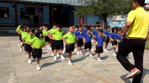 BANGKOK, THAILAND -  FEB 9, 2015: Unknown children, kindergarten Students are studying Physical Education in Schools at kindergarten School. Pieamsuwan school in bangkok at 2015.