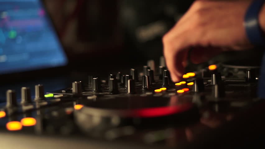 Sequence of DJ's hands playing on the mixer in the nightclub.
 | Shutterstock HD Video #9383783