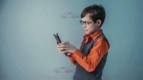 teenager boy with glasses plays the game  the race cars go on the tablet video hd 1920x1080