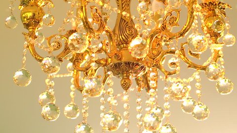 Gold chandelier with crystal balls. High speed camera shot. Full HD 1080p.