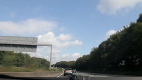 By car on the Autobahn in Germany. Shooting through the windshield