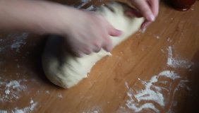 Woman knead dough on the table. HD video