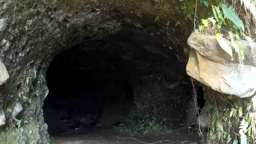 LAGUNA, PHILIPPINES - APRIL 15, 2014: lady explore cave interior