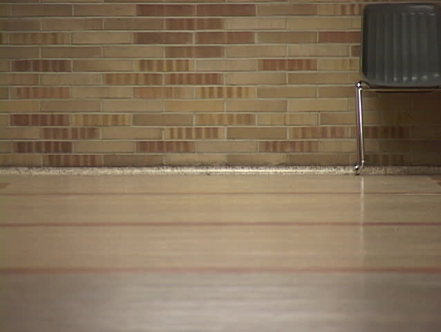 people walking down a hall.