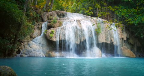 Waterfall in tropical jungle forest in central Thailand