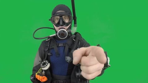 Dive instructor shows sing:LOOK AT MEalso a available on the green screen all of diving sings from course  with full dive gear (open water diver) all background from movies separately in portfolio1/06