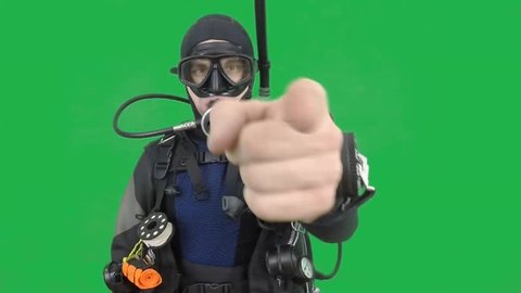 Dive instructor shows sing:LOOK AT MEalso a available on the green screen all of diving sings from course  with full dive gear (open water diver) all background from movies separately in portfolio5/06