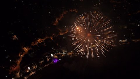 Aerial view on the big fireworks and concert at the city center square.
