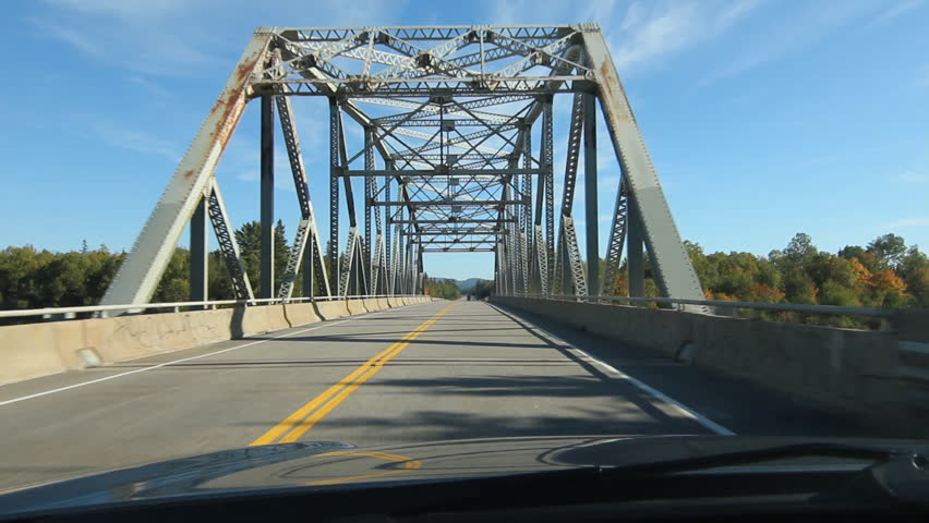 Truss bridge. Northern Ontario, Canada.
POV slow drive across a truss bridge that crosses the Agawa River. Trans Canada HWY No 1 or Hwy ON-17 in Northern Ontario, Canada.
