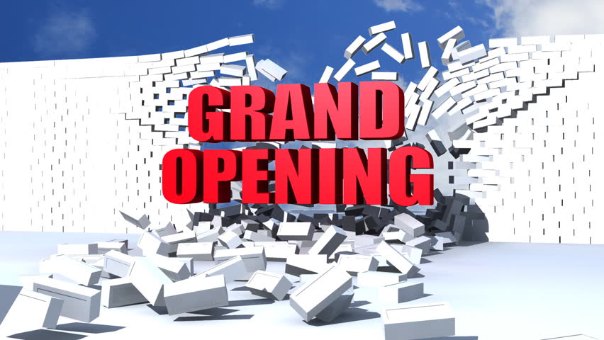 Red Grand Opening text comes crashing through a white brick wall.