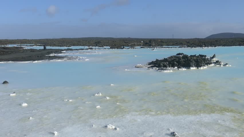 Blue Lagoon with black volcanic rocks around, Grindavik, Iceland. Blue Lagoon is one of the most visited attractions in Iceland.