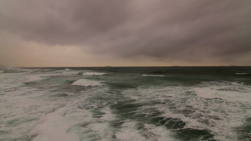 Moody emerald sea with storm clouds moving in.