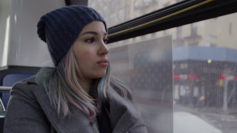 Pretty Girl Riding Public City Bus - New Yorker or Tourist Commuting - New York City Transportation - MTA Passenger at Back of Bus