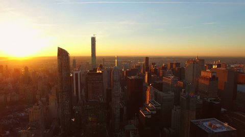 New York City Aerial v86 Flying low over Midtown Manhattan buildings towards beautiful sunrise. 3/13/15