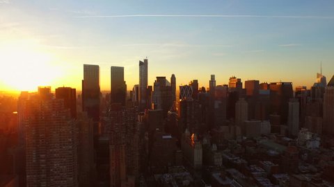 New York City Aerial v85 Flying low over West Side Manhattan buildings towards Midtown at sunrise. 3/13/15