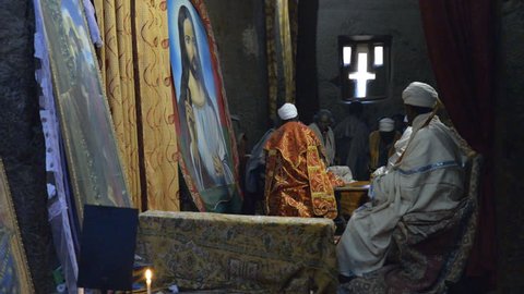 Lalibela, Ethiopia - January 5, 2015: Pilgrims praying in the church of Bete Medhane Alem in Ehtiopia, January 5, 2015.