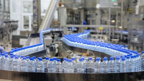 Production of clean water. Water bottle conveyor industry.