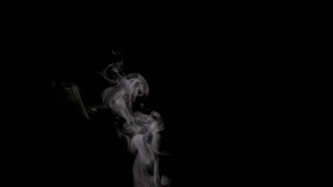 Steam Rises From the Cup. White smoke on black background. Motion at a rate of 240 fps