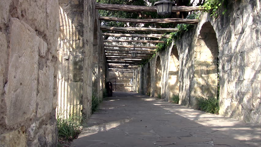 Video zoom in to hanging light in the entrance arched walk to the Alamo shrine in San Antonio Texas.