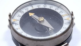 Close-up View of Compass with Rotating Arrow in a Male hand. 4K Ultra HD 3840x2160 Video Clip