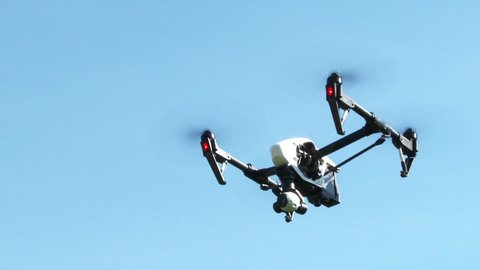 PORTLAND, OREGON - CIRCA 2015: Large drone quadcopter flying overhead with sound.