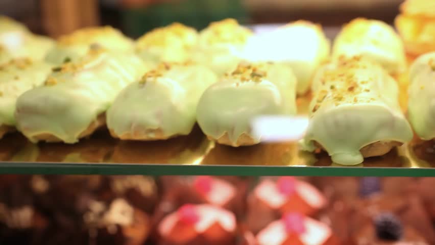 Showcase of cakes,  pastry in window display canteen for tasty desert food. HD. 1920x1080