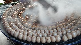 grilled Thai pork sausage mix rice on street market in Thailand 