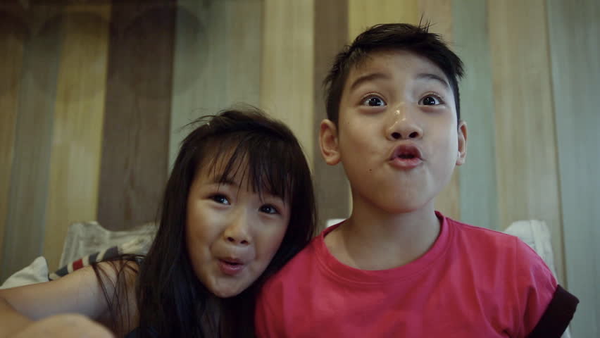 Portrait of asian kids, happy asian boy and girl looking at camera and smiling. Sequence