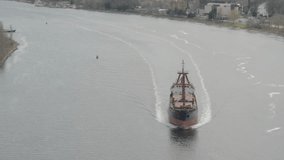 aerial video shot of cargo ship in a channel