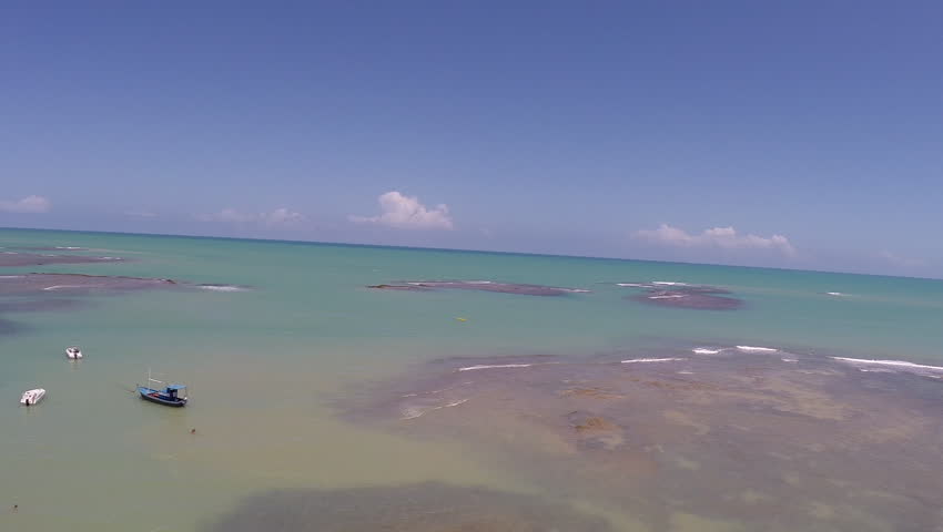 Aerial view of the coast line in Brazil with blue sea and reefs