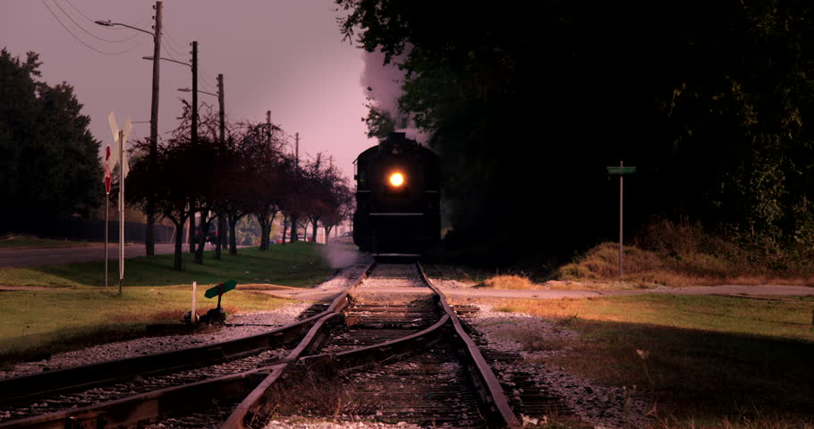 Old Steam engine locomotive train coming straight at camera