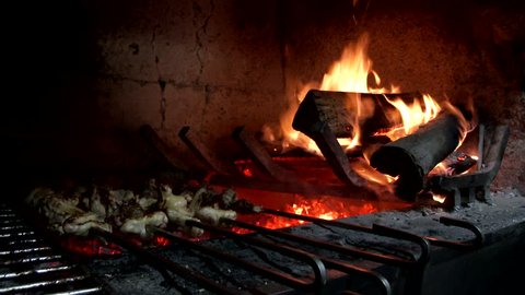 MADEIRA, PORTUGAL NOVEMBER 2014: Chicken grilling on fire 