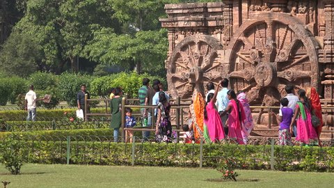 KONARK, INDIA - 4 DECEMBER 2014: People visit the Konark Sun Temple. The temple was built in the 13th century and is now a Unesco world heritage site.